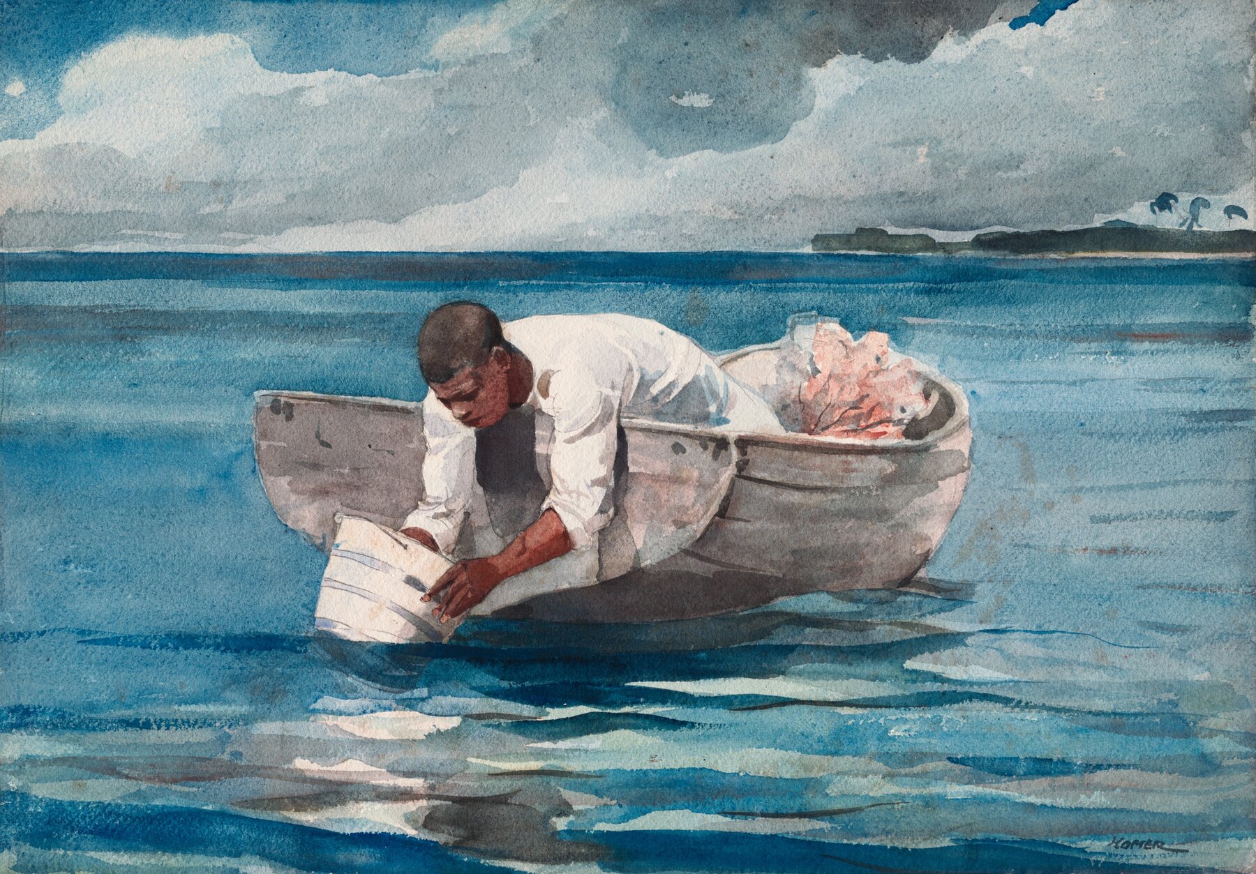 A young Black man intently searching for coral using a glass-bottomed bucket.