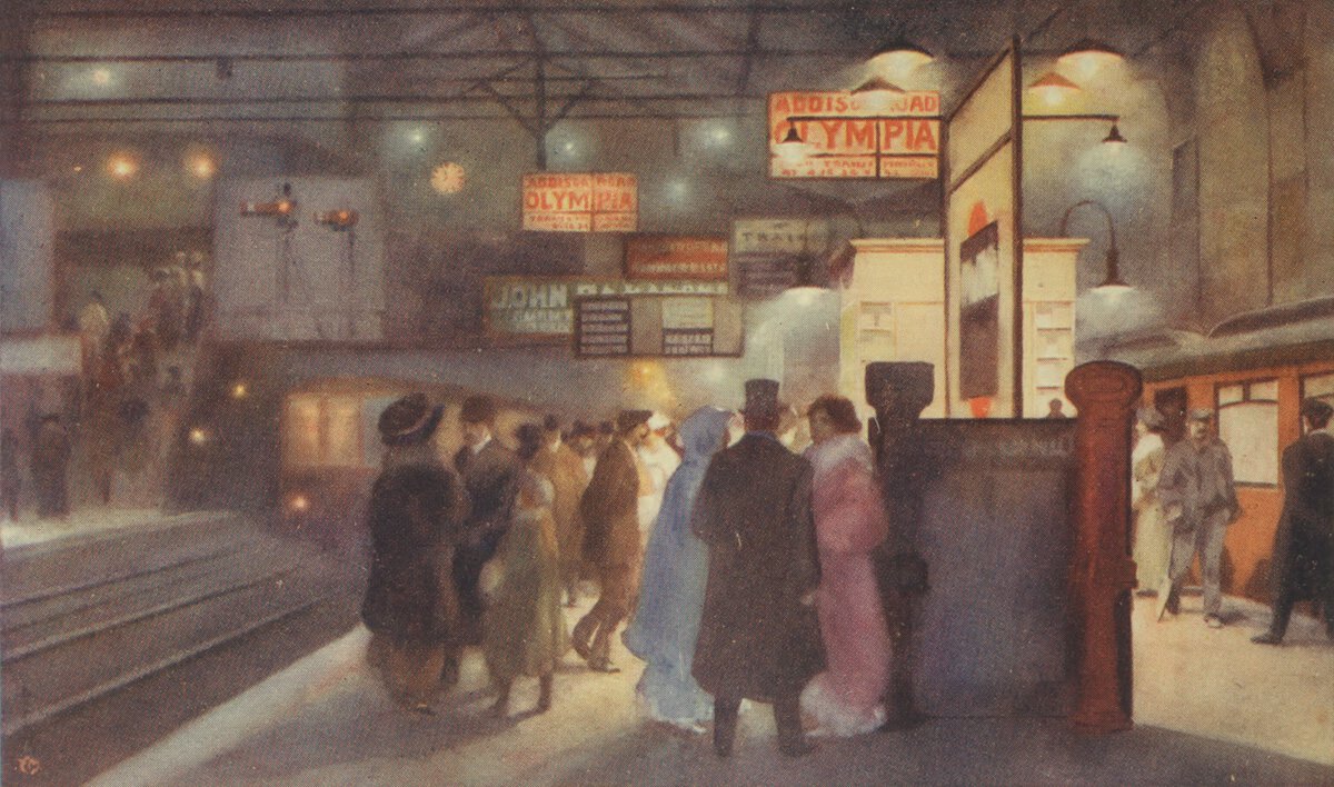 People, many in formal attire, standing outside at night with with lights and signs overhead.