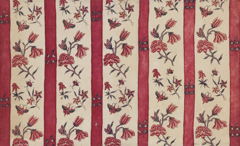 A chintz tapestry made of cotton with a light background, vertical red stripes, and red flowers in between the stripes.